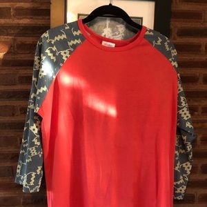 Lularoe randy tee with pattern sleeves.